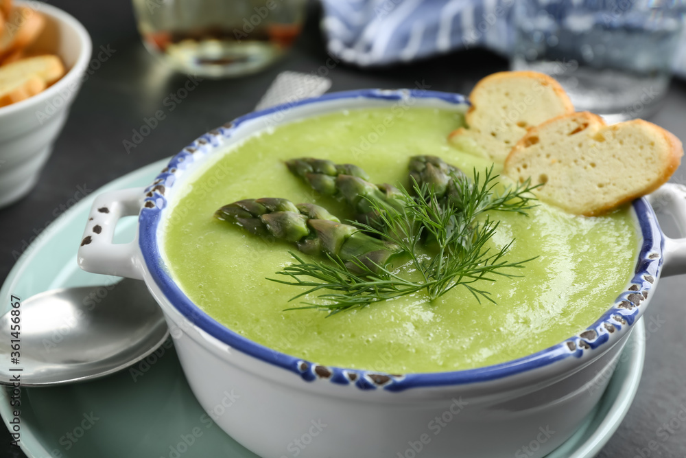 Delicious asparagus soup served in bowl, closeup Delicious asparagus soup served in bowl, closeup
