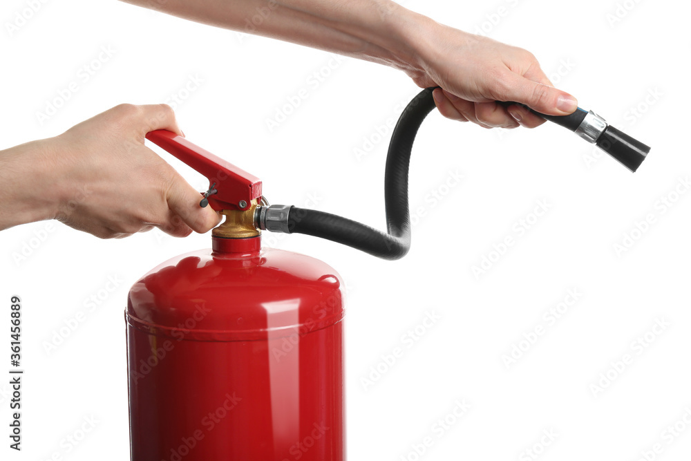 Naklejka premium Woman using fire extinguisher on white background, closeup
