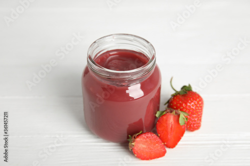Wallpaper Mural Healthy baby food in jar and fresh strawberries on white wooden table Torontodigital.ca
