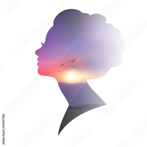 Double exposure of woman and sunset