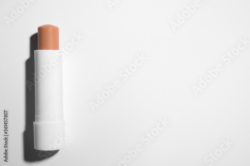 Hygienic lipstick on white background  top view