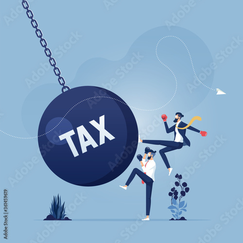 Businessman kicks a giant wrecking ball with a word tax