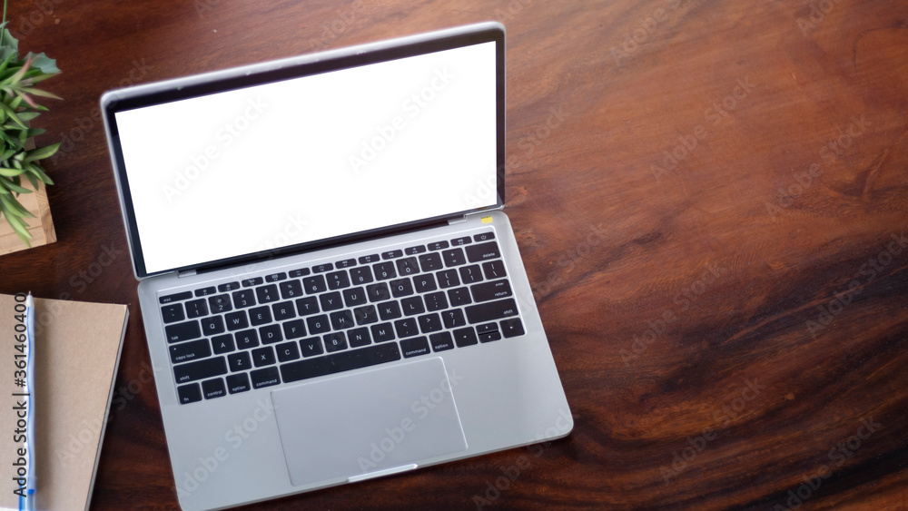 Laptop on wooden table with copy space ,top view Laptop on wooden table with copy space ,top view
