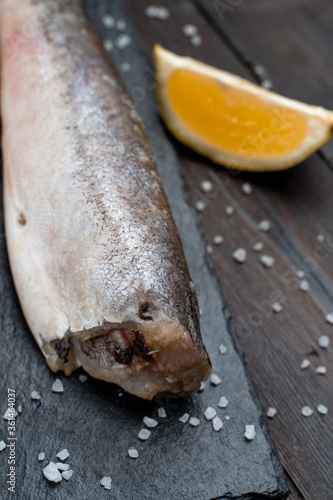 Close macro photo of freshly caught white fish without head and scale photo