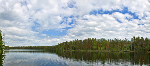 cloud sky above small forest lake