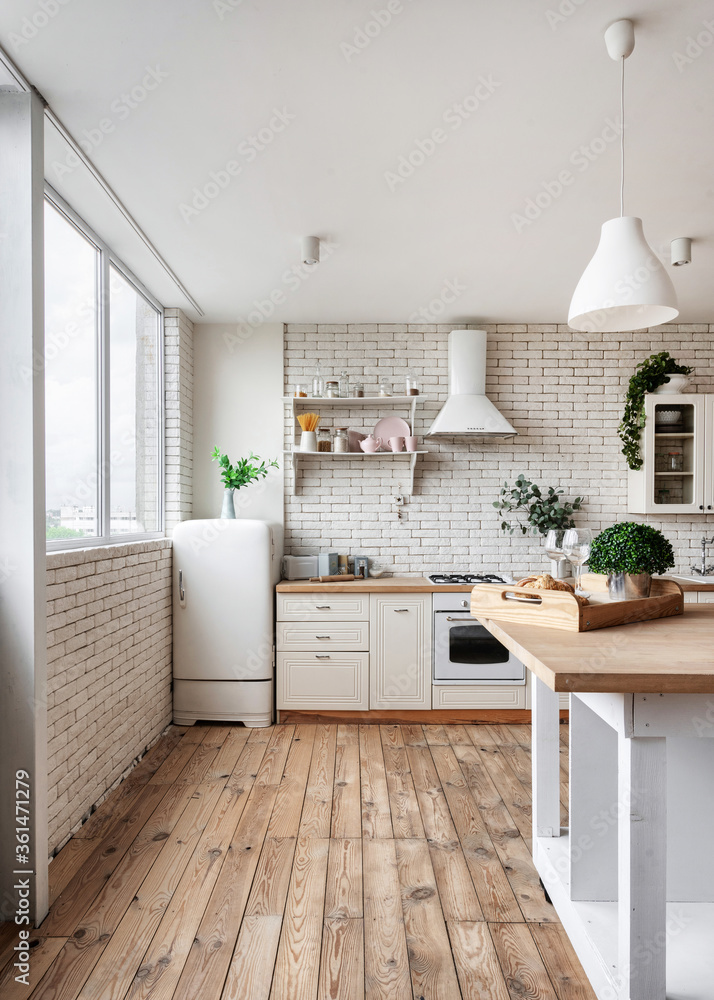 Fototapeta premium Kitchen at modern house with white interior design