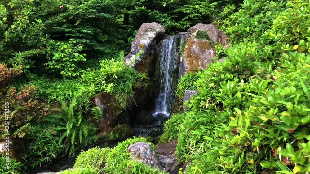 Beautiful waterfall in Japanese style garden Beautiful waterfall in Japanese style garden