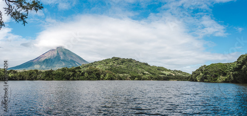 Lush greenery around Chaco Verde lake under the shadow of Volcán Maderas on Ometepe Island in Nicaragua photo