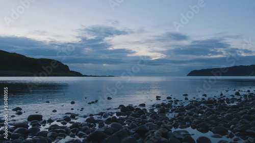 Ocean view from Porirua, near Wellington New Zealand - Dusk // Static Shot close to water photo