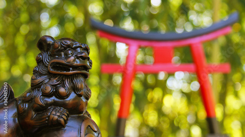 Photography Torii Gate and Okinawan Statue