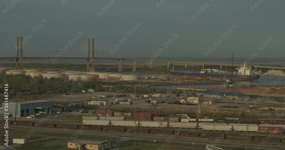 Mobile Alabama Aerial v10 Flying low over industrial trainyard area with cityscape views at sunset - March 2020 Mobile Alabama Aerial v10 Flying low over industrial trainyard area with cityscape views at sunset - March 2020