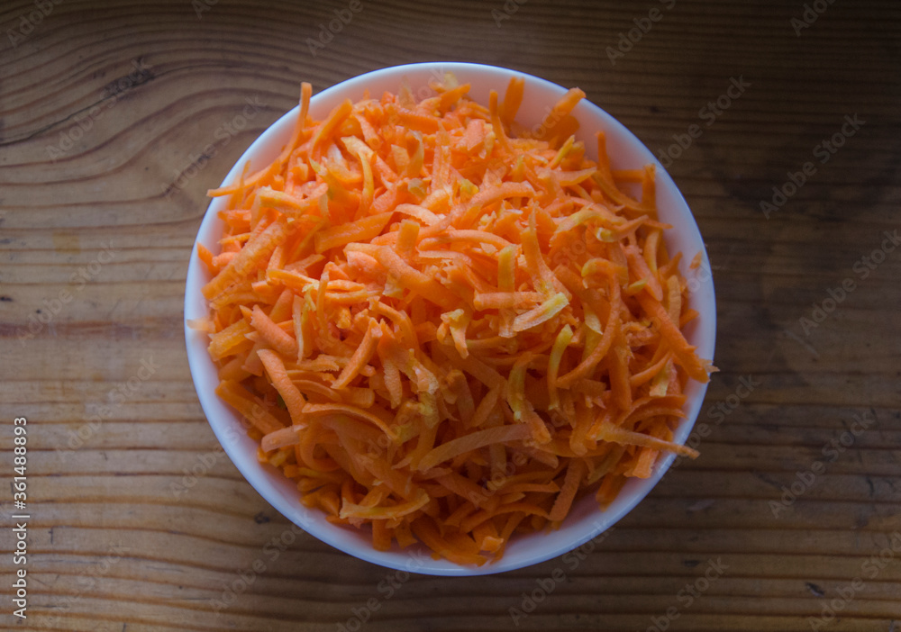 grated carrots on a plate grated carrots on a plate