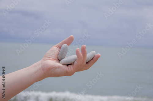hand with stones © sergeikorolev