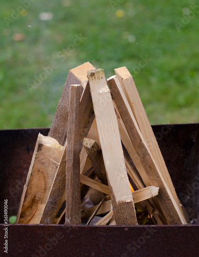 wood piled in a tent for a fire in a metal hearth
