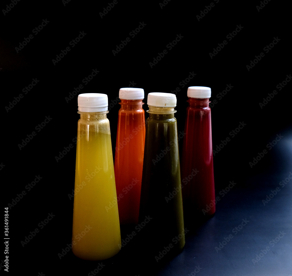 Fruit juice in a bottle on a Black background Fruit juice in a bottle on a Black background