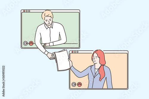 Business, video, conference, work, social distancing, quarantine, coronavirus concept. Young businessman and woman communicating and sending documents reports online. Remote call and working from home