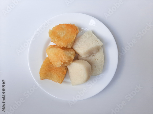 Wajik ketan, is a traditional snack from Indonesia, before and after fried. Made from sticky rice. On a white plate, isolated in white background.