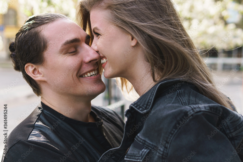 Fototapeta premium Young cheerful couple during a date outdoors