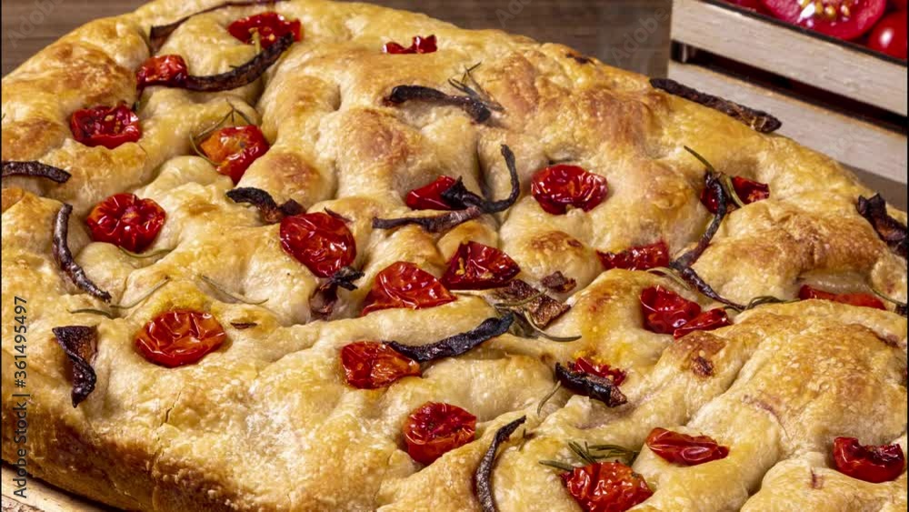 Traditional Italian Focaccia with pepperoni, cherry tomatoes, black