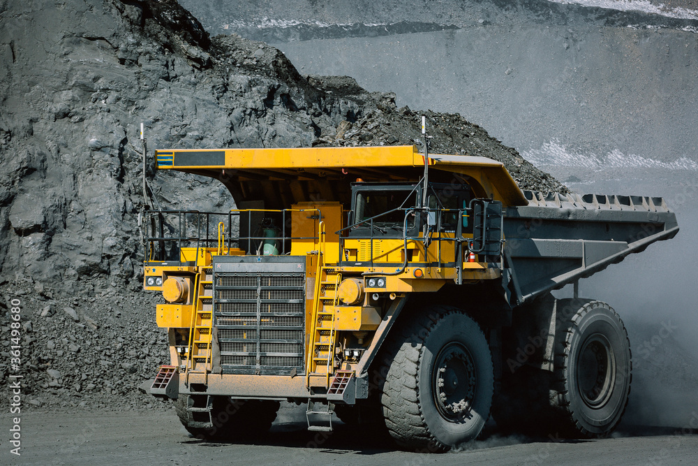 Career dump truck is going to the gold mining range.