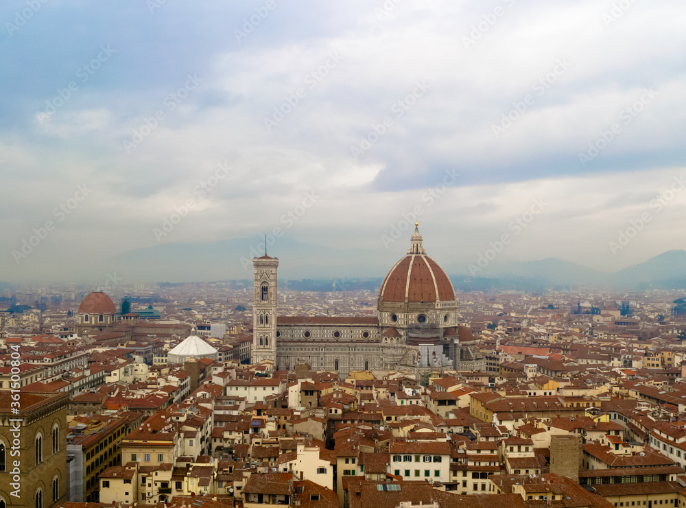 Fototapeta premium Firenze 2016, aerial view of the red roofs of the city and of the brunelleschi's dome of Santa Maria del Fiore church from the Arnolfo's tower