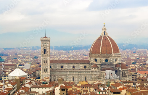 Firenze 2016, aerial view of the red roofs of the city and of the brunelleschi's dome of Santa Maria del Fiore church from the Arnolfo's tower photo