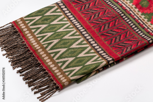 Tippet, shawl, scarf with Native American ornament and fringe.