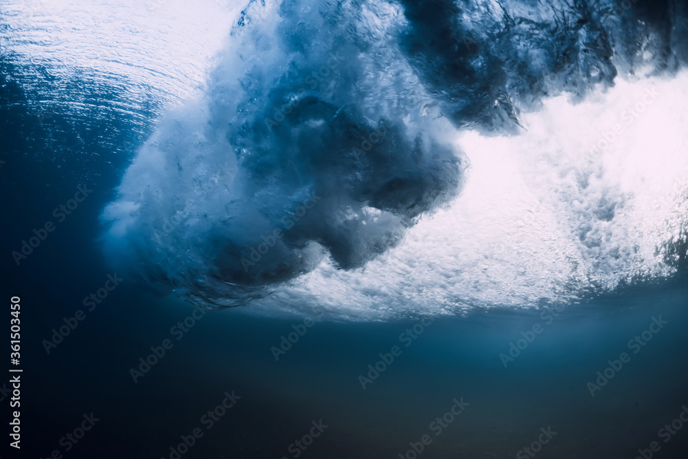 Underwater wave crashing in ocean. Transparent water underwater