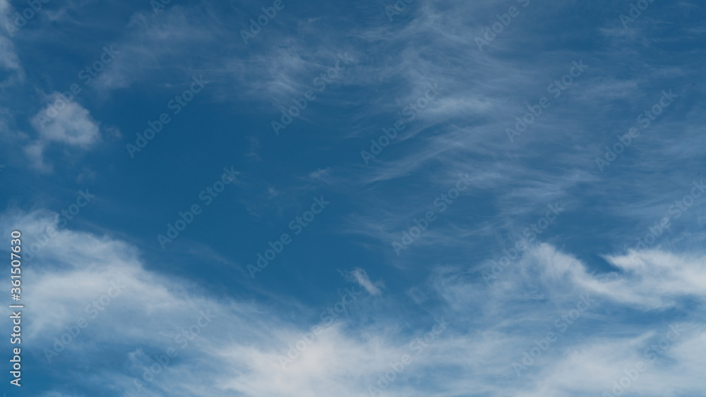 Blue sky with fluffy clouds, cloudscape, abstract background