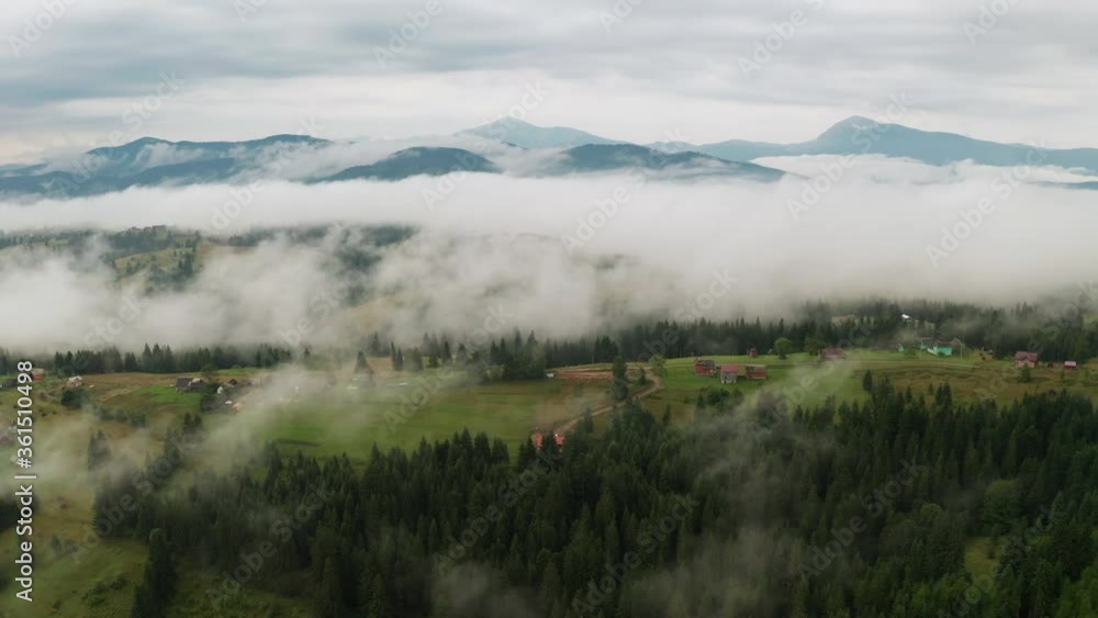Dramatic weather in the mountains after rain. Fog in the mountains, aerial view. Dramatic weather in the mountains after rain. Fog in the mountains, aerial view.