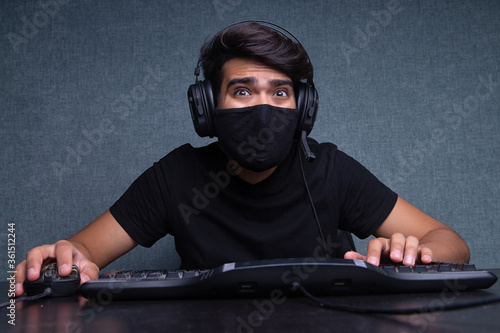 Young guy gamer playing an online video game