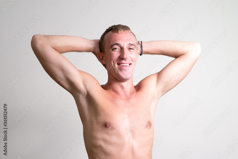 Portrait of happy man with blond hair smiling shirtless Portrait of happy man with blond hair smiling shirtless