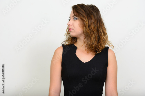 Portrait of young beautiful woman thinking and looking away