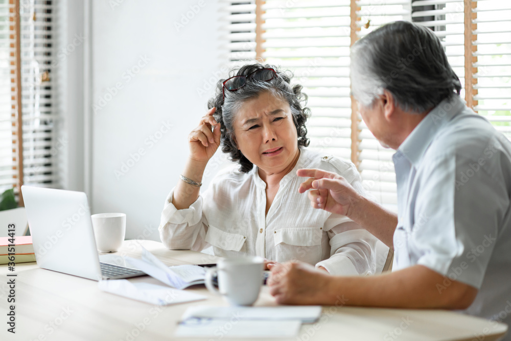 Senior mature man and woman having problem about family Financial crisis Senior mature man and woman having problem about family Financial crisis