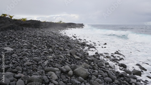 waves crashing on lava rocks