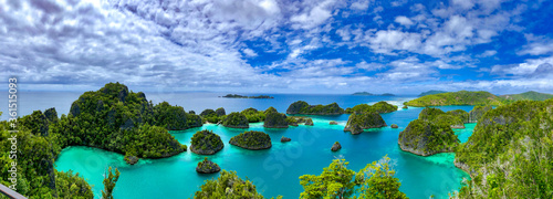 A beautiful lagoon is surrounded by limestone islands in Raja Ampat, West Papua, Indonesia. photo