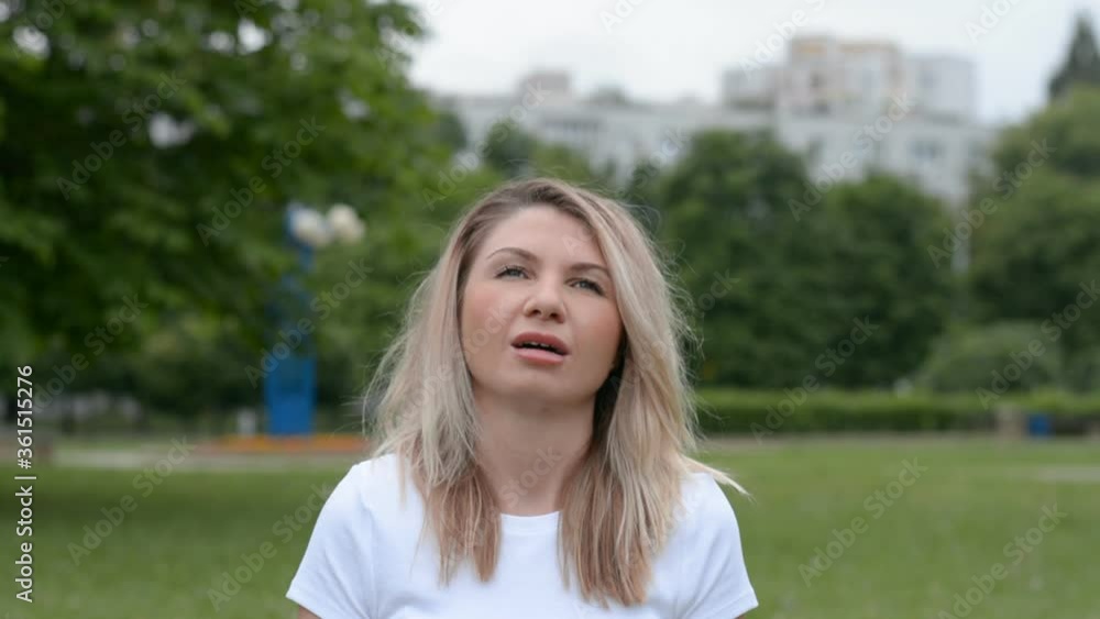 pretty caucasian woman portrait is looking at camera outdoor pretty caucasian woman portrait is looking at camera outdoor