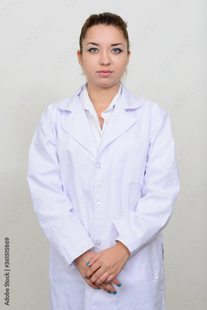 Portrait of young beautiful woman doctor looking at camera Portrait of young beautiful woman doctor looking at camera