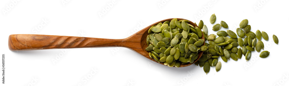 Wooden spoon with raw pumpkin seeds isolated on white Wooden spoon with raw pumpkin seeds isolated on white