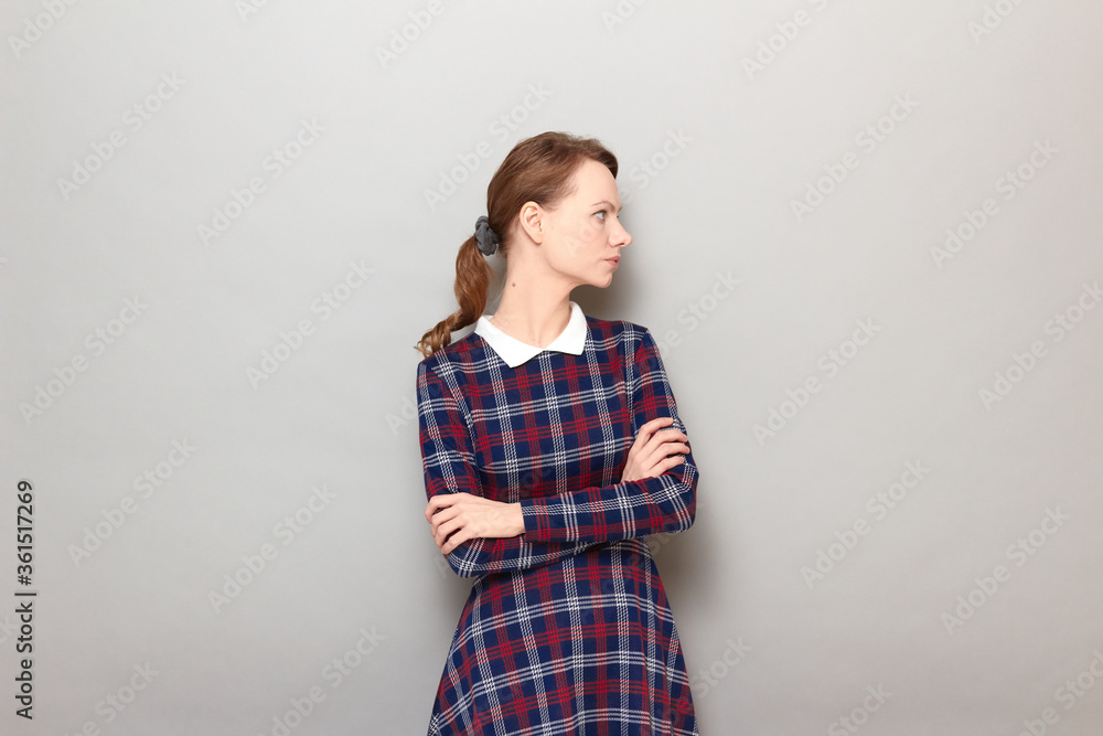 Portrait of serious focused annoyed girl crossing arms over body Portrait of serious focused annoyed girl crossing arms over body