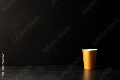 brown corrugated paper coffee cup on black background