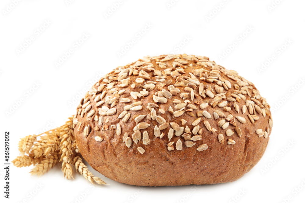 Dark whole grain bread with seeds and spikelet of wheat isolated on white background Dark whole grain bread with seeds and spikelet of wheat isolated on white background