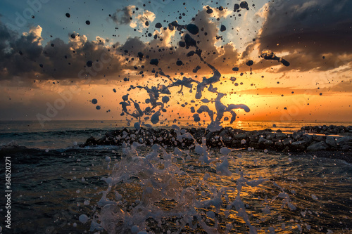 Εκτύπωση καμβά The waves breaking on a stony beach after summer storm