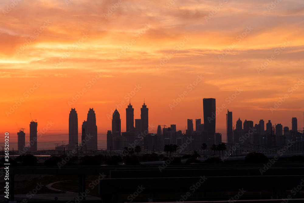 Beautiful panoramic view of dubai and burj khalifa at night. Sunset sky.