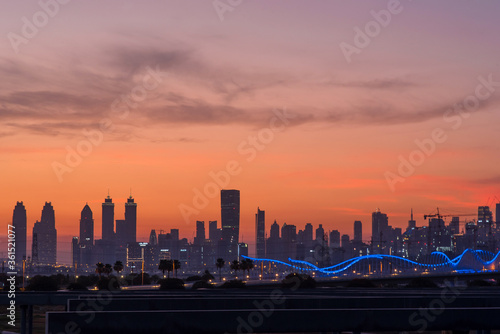 Beautiful panoramic view of dubai and burj khalifa at night. Sunset sky.