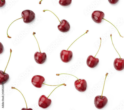 whole ripe red juicy sweet cherries isolated on a white background