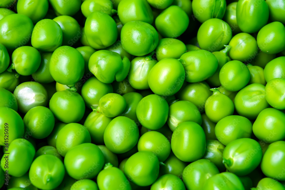 background of fresh, young, peeled green peas background of fresh, young, peeled green peas