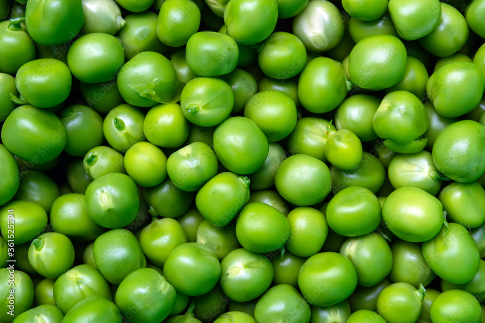 background of fresh, young, peeled green peas background of fresh, young, peeled green peas