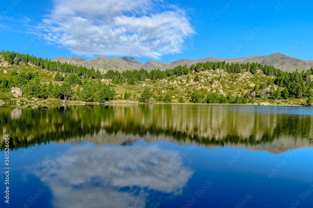 Morning reflections at the lake in the France Pyrenees, Capcir (Cerdanya Province, the Carlit Lakes)