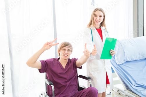 Patient in a wheelchair seemed happy to recover from illness or to go home.